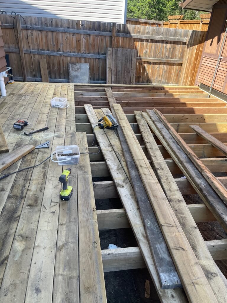 Wooden deck under construction with framing and tools by Dandy RenoWork